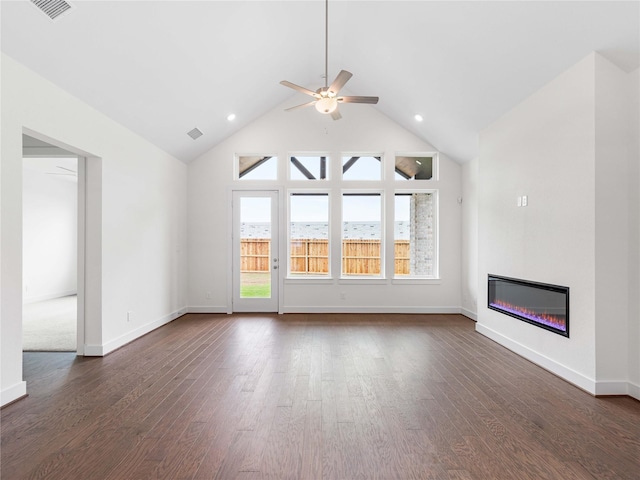 7517 Hawk Crest Dr, Fulshear, TX 77441 - unfurnished living room with ceiling fan, a glass covered fireplace, dark wood finished floors, recessed lighting, and high vaulted ceiling