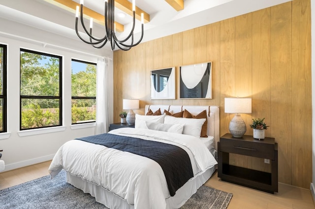 7517 Hawk Crest Dr, Fulshear, TX 77441 - bedroom featuring a chandelier, wood walls, and beamed ceiling