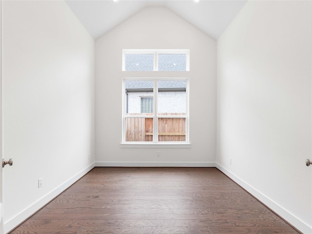 7517 Hawk Crest Dr, Fulshear, TX 77441 - empty room with vaulted ceiling and wood finished floors