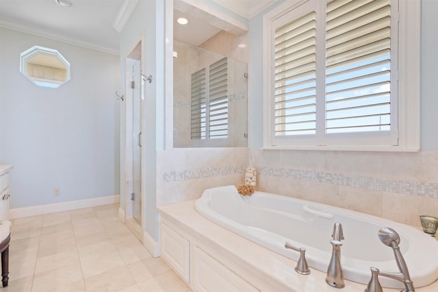 bathroom with tile patterned flooring, vanity, crown molding, a stall shower, and a bath