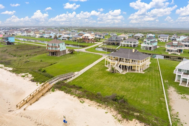 drone / aerial view featuring a residential view and a water view