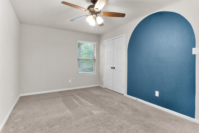 165 Camelot Place Ct, Conroe, TX 77304 - unfurnished bedroom with carpet, baseboards, a closet, and ceiling fan