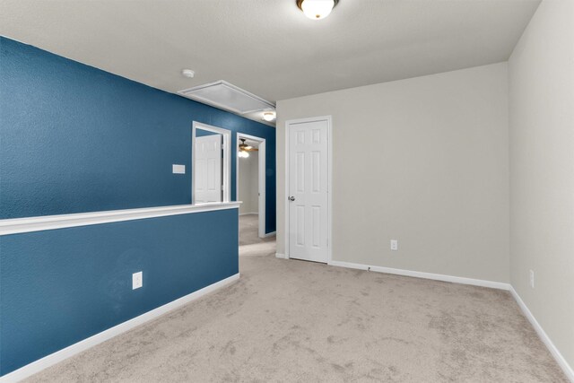 165 Camelot Place Ct, Conroe, TX 77304 - carpeted empty room featuring attic access, baseboards, and a smoke detector