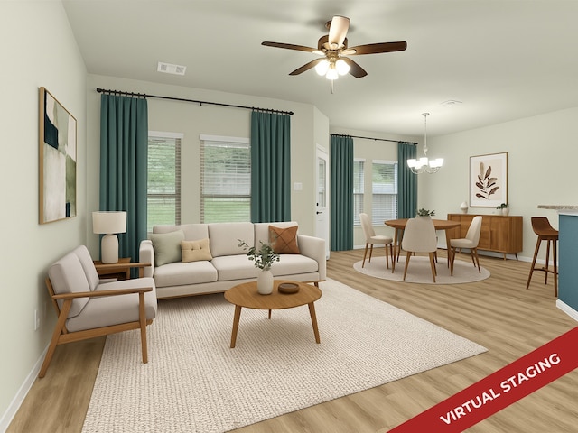 165 Camelot Place Ct, Conroe, TX 77304 - living area featuring wood finished floors, baseboards, a ceiling fan, and a chandelier