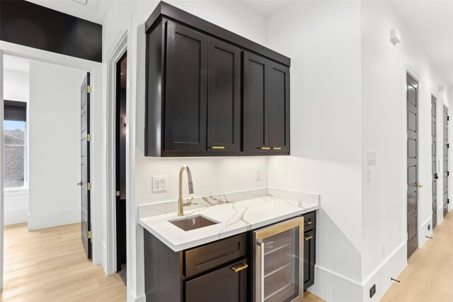 3902 Charleston St, Houston, TX 77021 - indoor wet bar featuring beverage cooler and light wood-type flooring