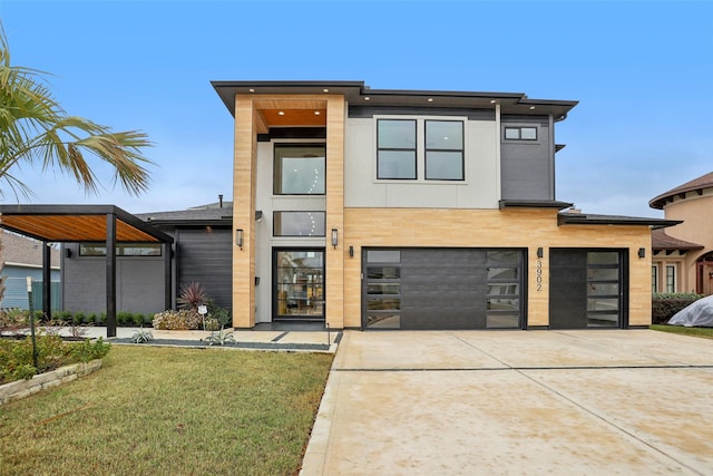 3902 Charleston St, Houston, TX 77021 - contemporary home featuring driveway, an attached garage, and a front yard