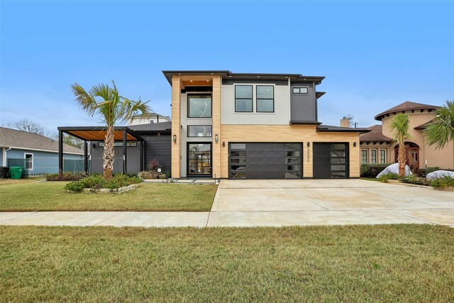 3902 Charleston St, Houston, TX 77021 - modern home featuring an attached garage, concrete driveway, and a front lawn