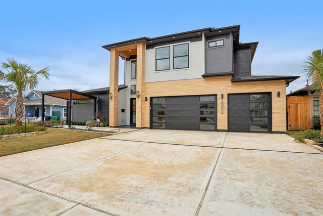 3902 Charleston St, Houston, TX 77021 - modern home with a garage, driveway, and stucco siding