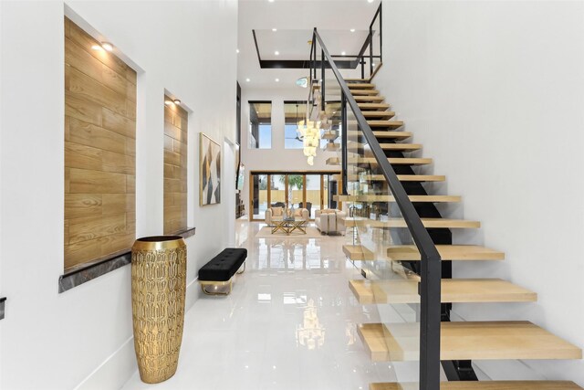 3902 Charleston St, Houston, TX 77021 - staircase with a towering ceiling, a chandelier, and recessed lighting