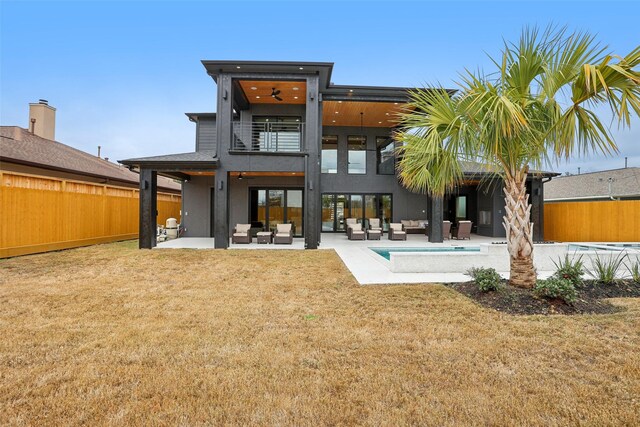 3902 Charleston St, Houston, TX 77021 - back of house featuring an outdoor hangout area, a balcony, a fenced backyard, a patio, and stucco siding