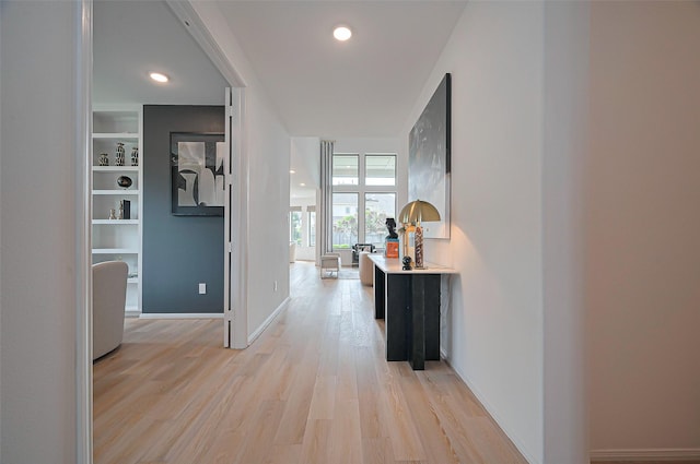 2611 Oakland Park Dr, Conroe, TX 77385 - corridor with light wood-style flooring, baseboards, and recessed lighting