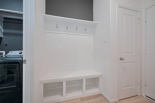 2611 Oakland Park Dr, Conroe, TX 77385 - mudroom featuring washer / clothes dryer and light wood finished floors
