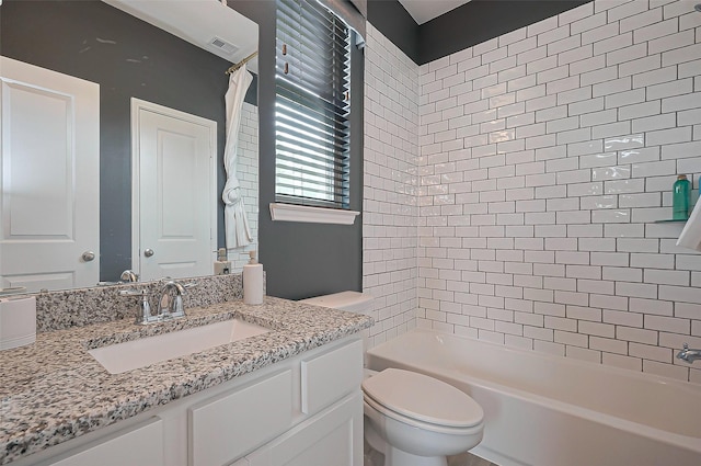 2611 Oakland Park Dr, Conroe, TX 77385 - bathroom featuring toilet, vanity, and washtub / shower combination