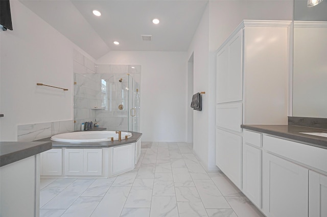 2611 Oakland Park Dr, Conroe, TX 77385 - full bathroom featuring marble finish floors, a shower stall, recessed lighting, a garden tub, and vanity