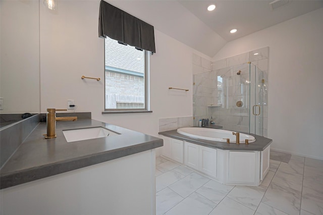 2611 Oakland Park Dr, Conroe, TX 77385 - full bath with marble finish flooring, a stall shower, vanity, a bath, and recessed lighting