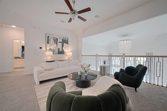 2611 Oakland Park Dr, Conroe, TX 77385 - living room featuring a ceiling fan, light carpet, a chandelier, and baseboards