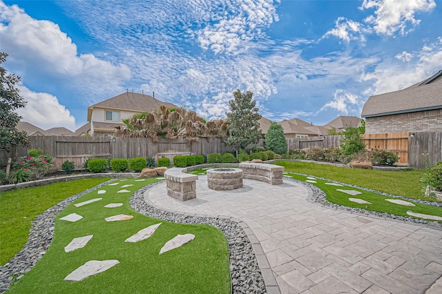 2611 Oakland Park Dr, Conroe, TX 77385 - view of patio / terrace featuring an outdoor fire pit and a residential view