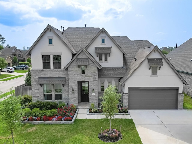 2611 Oakland Park Dr, Conroe, TX 77385 - view of front of home with stone siding, stucco siding, and a shingled roof