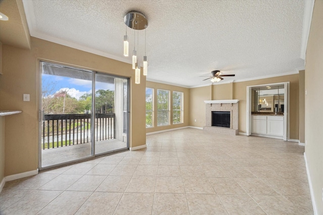 unfurnished living room featuring ornamental molding, baseboards, tile patterned floors, a ceiling fan, and a fireplace