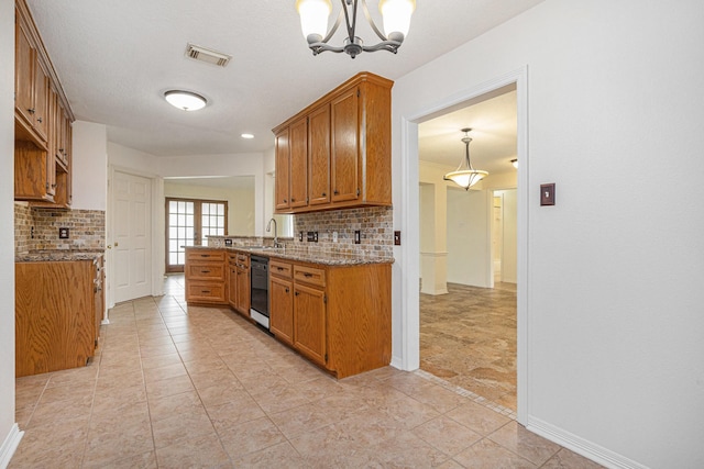 kitchen featuring decorative backsplash, brown cabinetry, black dishwasher, a chandelier, and a sink