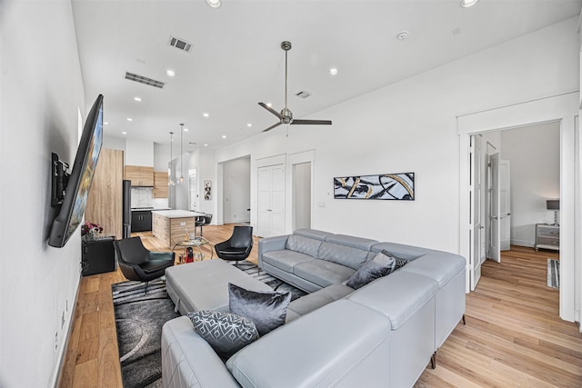 3402 Asher Landing Ln, Houston, TX 77080 - living room featuring visible vents, ceiling fan, and light wood-style floors