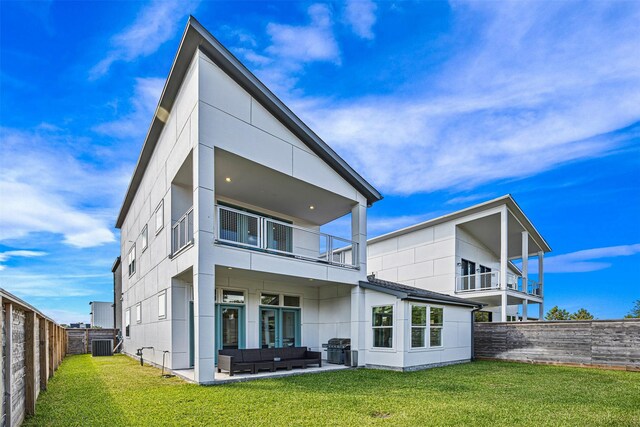 3402 Asher Landing Ln, Houston, TX 77080 - back of property with outdoor lounge area, a fenced backyard, a lawn, a patio area, and a balcony