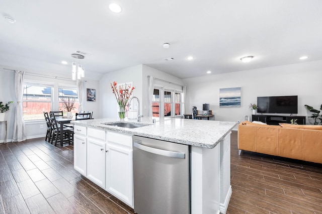 23818 Northwood Terrace Ln, Katy, TX 77493 - kitchen with wood tiled floor, a sink, light stone counters, open floor plan, and stainless steel dishwasher