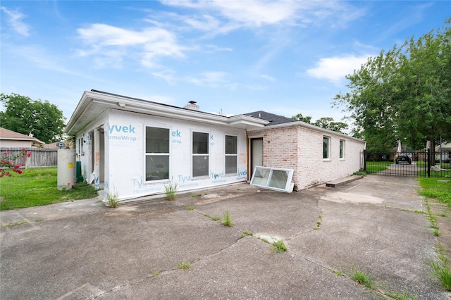 6206 Yarwell Dr, Houston, TX 77096 - rear view of house featuring brick siding and a chimney