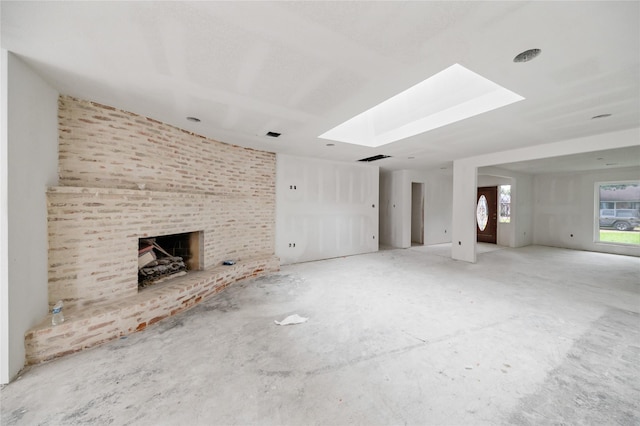6206 Yarwell Dr, Houston, TX 77096 - unfurnished living room with a brick fireplace and a skylight