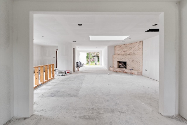 6206 Yarwell Dr, Houston, TX 77096 - unfurnished living room featuring a brick fireplace and a skylight