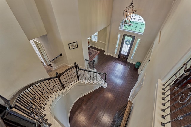 21610 Harbor Water Dr, Cypress, TX 77433 - foyer entrance with a high ceiling, stairs, hardwood / wood-style flooring, baseboards, and a chandelier