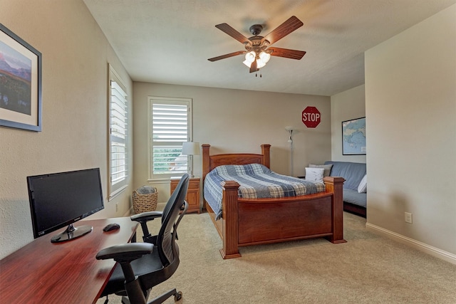 21610 Harbor Water Dr, Cypress, TX 77433 - bedroom featuring light carpet, a desk, a ceiling fan, and baseboards