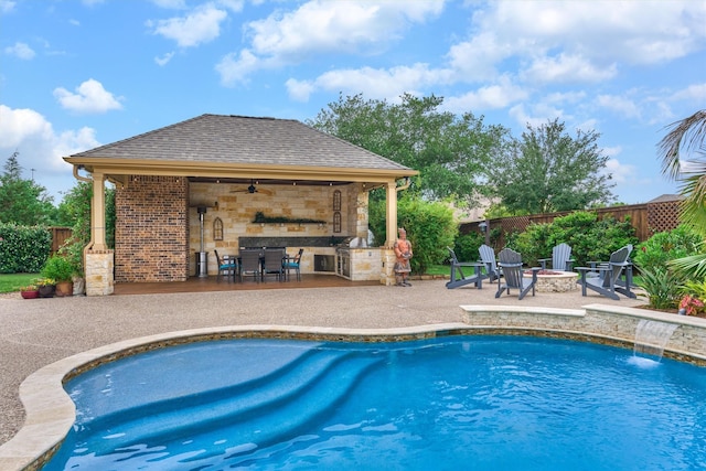 21610 Harbor Water Dr, Cypress, TX 77433 - view of pool with an outdoor fire pit, a patio area, a fenced backyard, an outdoor bar, and ceiling fan