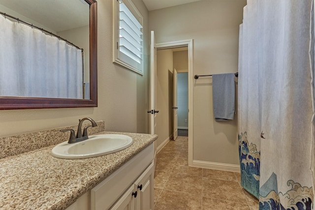 21610 Harbor Water Dr, Cypress, TX 77433 - bathroom featuring vanity, tile patterned flooring, and baseboards
