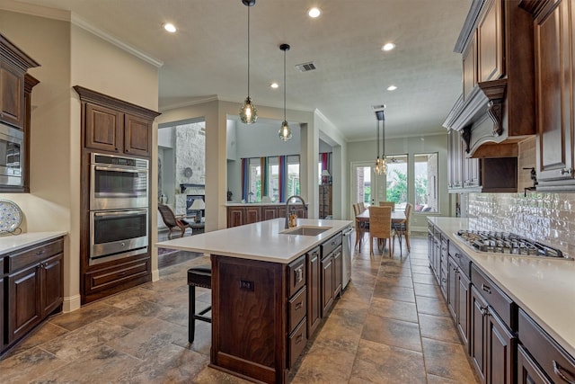 21610 Harbor Water Dr, Cypress, TX 77433 - kitchen featuring appliances with stainless steel finishes, recessed lighting, light countertops, tasteful backsplash, and ornamental molding