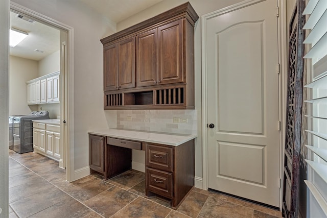 21610 Harbor Water Dr, Cypress, TX 77433 - unfurnished office with independent washer and dryer, dark stone finish flooring, and built in study area