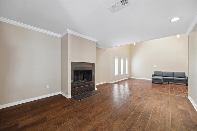 unfurnished living room with ornamental molding, a fireplace with flush hearth, baseboards, dark wood-style floors, and visible vents