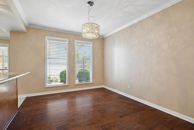 unfurnished dining area featuring dark wood-style flooring, ornamental molding, baseboards, and a notable chandelier