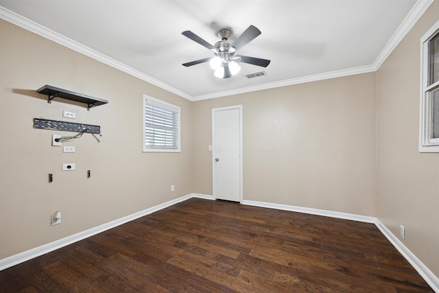 unfurnished room with crown molding, baseboards, visible vents, a ceiling fan, and wood finished floors