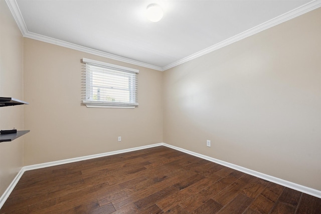 empty room with ornamental molding, baseboards, and wood finished floors