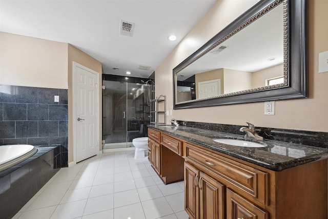 bathroom with a sink, a stall shower, and visible vents