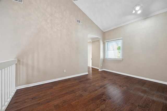 unfurnished room featuring baseboards, visible vents, crown molding, and wood-type flooring