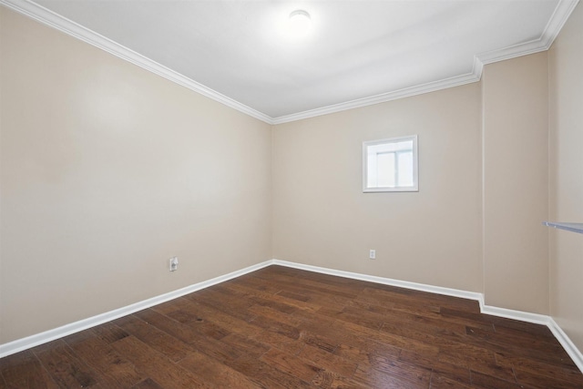empty room with dark wood-style flooring, crown molding, and baseboards