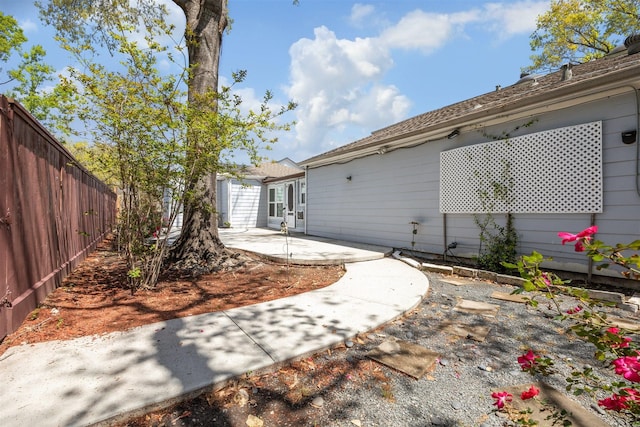 view of yard with a patio and a fenced backyard