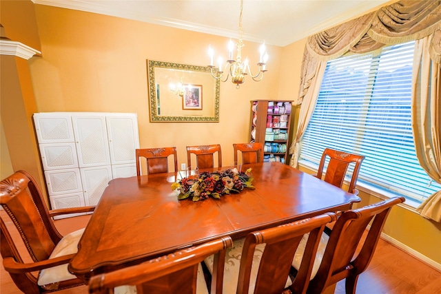 6019 Spanish Oak Dr, Pasadena, TX 77505 - dining room featuring a chandelier, wood finished floors, baseboards, and ornamental molding