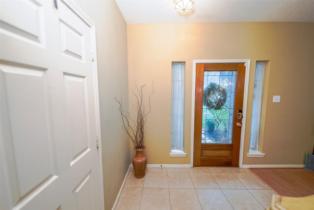6019 Spanish Oak Dr, Pasadena, TX 77505 - entryway with baseboards and light tile patterned flooring