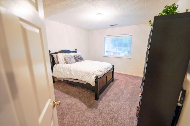 6019 Spanish Oak Dr, Pasadena, TX 77505 - carpeted bedroom with a textured ceiling, baseboards, and visible vents