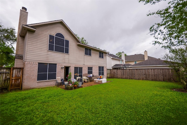 6019 Spanish Oak Dr, Pasadena, TX 77505 - rear view of property with a fenced backyard, brick siding, and a yard