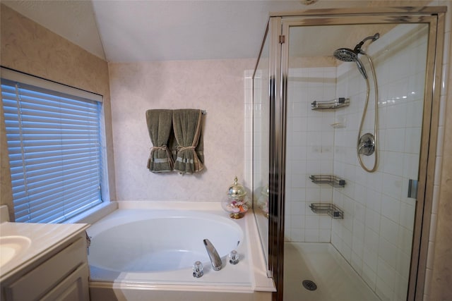 6019 Spanish Oak Dr, Pasadena, TX 77505 - bathroom with a shower stall, a garden tub, vanity, and vaulted ceiling