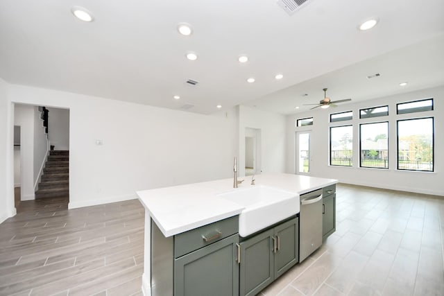 14647 Cedar Elm Ct, Willis, TX 77318 - kitchen featuring dishwasher, open floor plan, a ceiling fan, recessed lighting, and light countertops